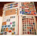 A GENERAL COLLECTION IN THREE ALBUMS, GB, USA, INDIAN STATES, BAHRAIN, IRAQ ETC.