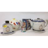 18TH CENTURY BLUE AND WHITE TEAPOT AND FLASK WITH TWO MATCHING STANDS PAINTED WITH A CREST,