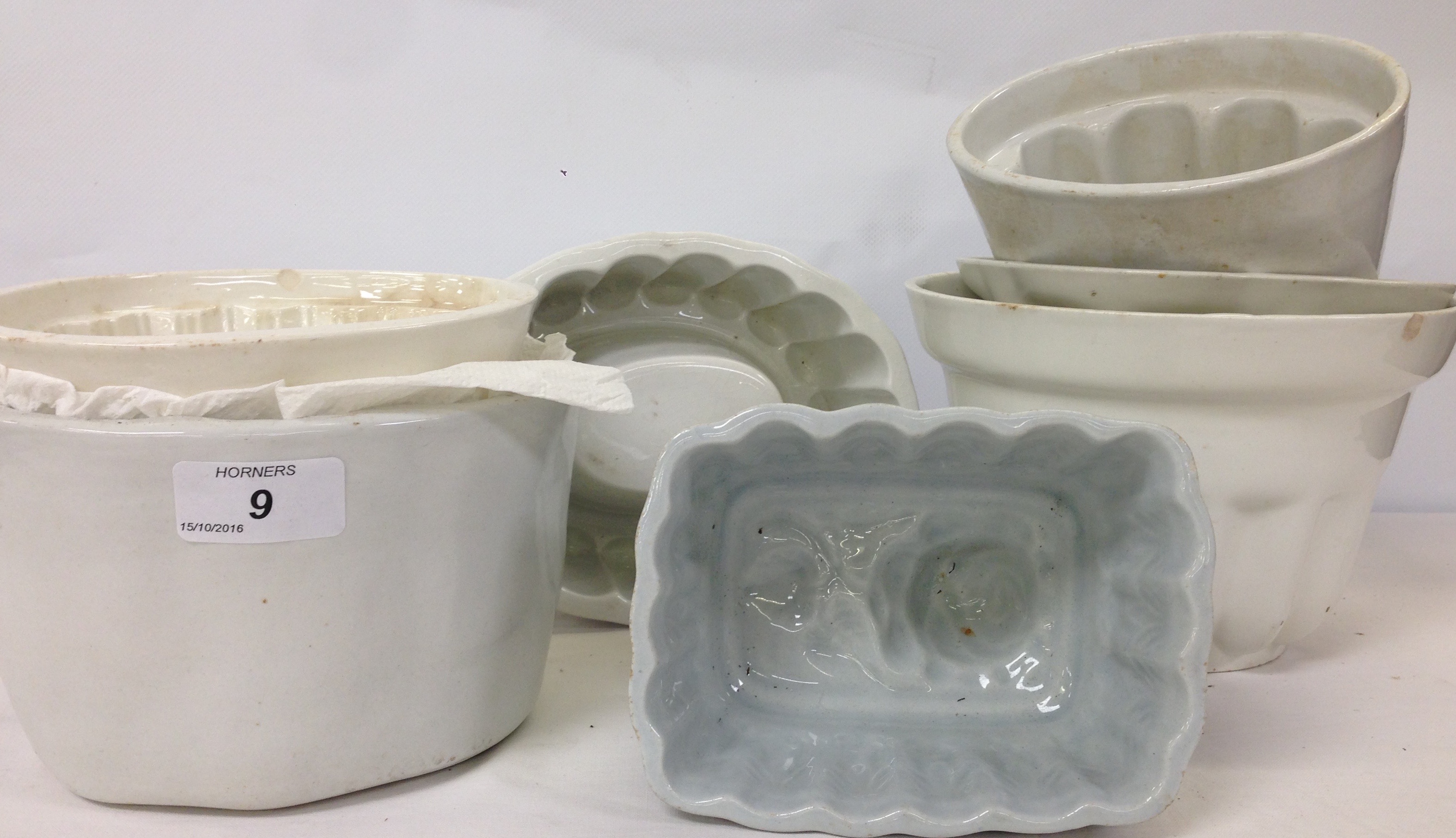 SEVEN ASSORTED WHITE POTTERY JELLY MOULDS