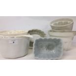 SEVEN ASSORTED WHITE POTTERY JELLY MOULDS