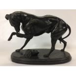 ANTIQUE SPELTER FIGURE OF A GREYHOUND STANDING ON AN OVAL PLINTH