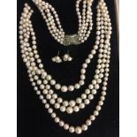 A FOUR STRAND CULTURED PEARL NECKLACE WITH MARCASITE CLASP AND A PAIR OF PEARL EARRINGS