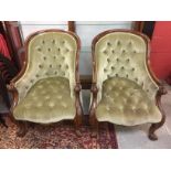 A PAIR OF VICTORIAN WALNUT BUTTON BACK CHAIRS WITH GREEN VELOUR UPHOLSTERY