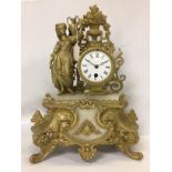 FRENCH CAST CLOCK DECORATED WITH FEMALE WATER CARRIER AND VASE OF FLOWERS,