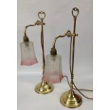 PAIR OF BRASS ADJUSTABLE LAMPS WITH ETCHED CRANBERRY SHADES,