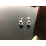 PAIR OF SOLITAIRE WHITE STONE EARRINGS