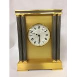 HEAVY BRASS MANTEL CLOCK WITH COLUMN DETAIL MARKED "LOOPING"