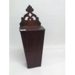 AN ANTIQUE CANDLE BOX WITH FRETTED HANGER,