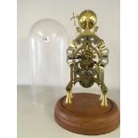 A REPRODUCTION BRASS STEEPLE SKELETON CLOCK WITH FUSEE MOVEMENT UNDER GLASS CIRCULAR DOME WITH BELL