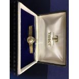 LADIES 9CT. GOLD TISSOT WRIST WATCH ON 9CT.