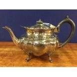 A SILVER TEAPOT WITH EBONISED HANDLE AND KNOB SHEFFIELD1926 BY J.R.