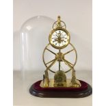 A REPRODUCTION SINGLE FUSEE BIG WHEEL SKELETON CLOCK UNDER GLASS CASE ON A MAHOGANY PLINTH