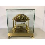 A REPRODUCTION WILLIAM CONGREVE ROLLING BALL CLOCK UNDER GLASS CASE WITH MAHOGANY PLINTH