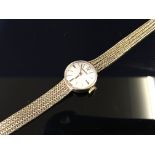 LADIES 9CT. GOLD GARRARD BRACELET WATCH (PRESENTATION INSCRIPTION TO BACK)