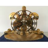 A REPRODUCTION BRASS FUSEE SKELETON CLOCK WITH VERGE ESCAPEMENT UNDER SQUARED GLASS DOME MOUNTED ON