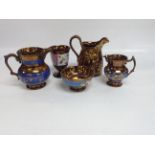 A PAIR OF STAFFORDSHIRE COPPER FINISH CHERUB JUGS AND 2 OTHER JUGS,