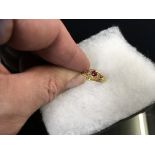 18CT. GOLD THREE STONE PERIOD RUBY RING