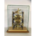 A REPRODUCTION BRASS "FACTORY CLOCK" WITH AUTOMATED FIGURES,