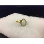 18CT. GOLD OPAL AND DIAMOND RING