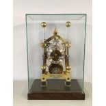 A REPRODUCTION BRASS HARRISON'S MARINE CLOCK WITH GRASSHOPPER ESCAPEMENT UNDER GLASS CASE WITH
