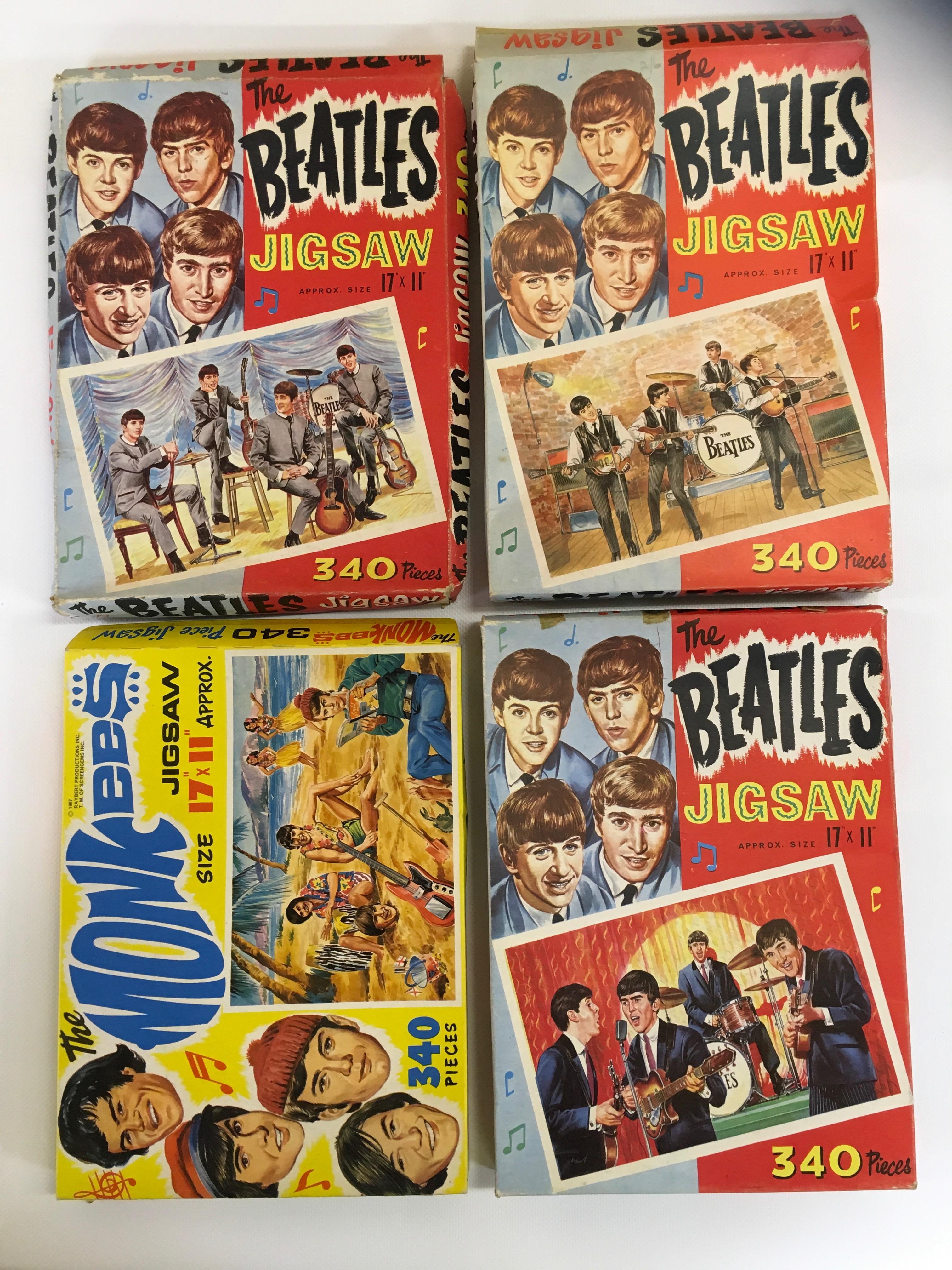 THREE "THE BEATLES 340 PIECE JIGSAW PUZZLES AND "THE MONKEES' 340 PIECE JIGSAW