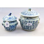 Two 18th century Chinese blue and white covered jars, each with kylin finial and pierced handles,