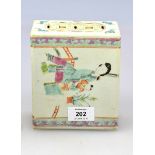 A 19th century Chinese famille rose cash pierced flower brick, decorated with figures in interiors