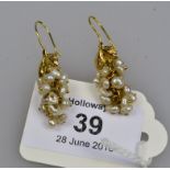 A pair of cluster blister pearl earrings, modelled as a bunch of grapes from a leaf shaped mount