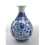 A Chinese blue and white porcelain baluster form bottle vase, with Ming style zoned Islimi