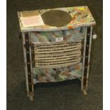 An Art Deco marbled iron electric boudoir stove, with hot plate (not for use)