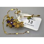 A 9ct gold and amethyst leaf brooch, a peridot and seed pearl bar brooch and a 9ct gold box link