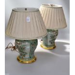 A pair of 20th century Chinese famille verte baluster lamps, with brass mounts and twin lights, with