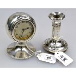 An Art Deco silver cased desk clock, of capstan form on spreading circular base, with silvered