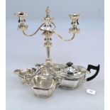 A silver plated three piece teaset, of panelled oval form, with gadrooned borders and leaf capped