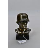 A circa 1980s cast bronze head and shoulders bust of a World War II German soldier,wearing a M1940