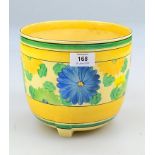 A Clarice Cliff Bizarre Sungay pattern jardiniere of cylindrical form, on three moulded feet,