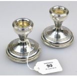 B and Co, a pair of silver dwarf candlesticks of plain form, with ribbed bands, Birmingham 1971, 6.