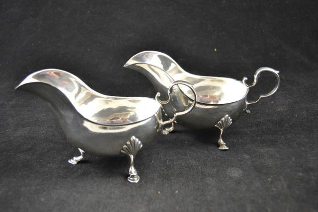 A pair of late Victorian silver sauceboats on shell and hoof feet, Sheffield 1898,