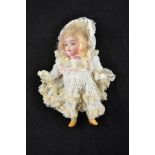 A German bisque headed doll with composition body, blue eyes,