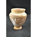 A Roman/Greek terracotta vase with winged chariot and figures in relief,