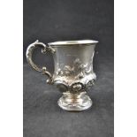 A Victorian embossed silver christening mug of campana form, monogram to cartouche, London 1848,