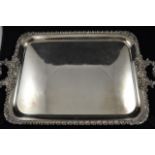 A late 19th /early 20th century two handled silver plated serving tray with scroll design to edge