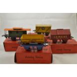 Four boxed Hornby O gauge goods wagons - side tipping wagon RS679, cement wagon RS660,