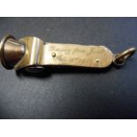 An early 20th century 9ct gold cigar cutter with presentation inscription,