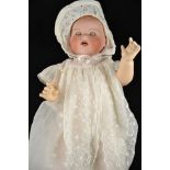 An Armand Marseille bisque headed doll, sleepy blue eyes, open mouth with teeth, no.