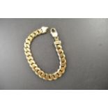 A 9ct gold gents heavy curb link bracelet, length 22cm - approx weight 44.