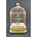 A 19th/early 20th Century singing bird automaton in gilt wirework cage, clockwork movement to base,