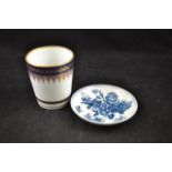 A Worcester saucer with underglaze blue decoration depicting flowers and butterflies,