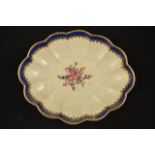 A first period Worcester oval scalloped dish, gilt and blue border,