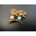 An 18ct gold Hans George Mautner style gem encrusted 'bird' brooch - approx gross weight 12.